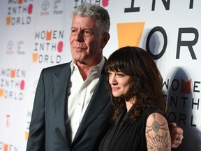 In this file photo taken on April 13, 2018 Chef Anthony Bourdain and Italian actress Asia Argento attend the 2018 Women In The World Summit at Lincoln Center in New York City.