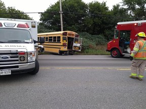 Several children were slightly injured when their school bus was involved in a collision with a truck Thursday. The truck driver has been charged.