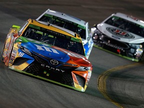 Kyle Busch, driver of the #18 M&M's Toyota, leads a pack of cars during the Monster Energy NASCAR Cup Series Federated Auto Parts 400 at Richmond Raceway on Sept. 22, 2018 in Richmond, Va.