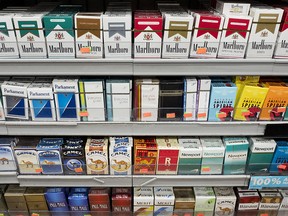 Cigarettes are displayed on a shelf, Monday, Aug. 28, 2017, in New York. (AP Photo/Mark Lennihan)