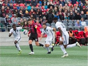 Fury FC captain Carl Haworth tries to pull away from Bethlehem Steel FC's Prosper Chiluya, left,, Matthew Mahony, middle, and Benjamin Ofeiyu during Sunday's contest. Steve Kingsman/Freestyle Photography for Ottawa Fury FC