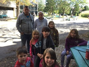 Construction worker Daniel Dorris and his wife Natasha Picard, rear and their six children, at the Gatineau emergency centre on Saturday, Sept. 22.