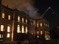 Firefighters work the fire at the 200-year-old National Museum of Brazil, in Rio de Janeiro, Brazil, Sunday, Sept. 2, 2018. (AP Photo/Leo Correa)