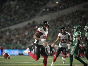 Redblacks running back William Powell celebrates a first-half touchdown against the Roughriders in Regina on Saturday night.