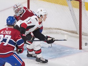 The puck finds its way to the back of tghe net after Senators rookie forward Brady Tkachuk (7) scores against Canadiens goaltender Carey Price in the first period of Saturday's game in Montreal.
