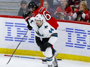 Defenceman Erik Karlsson (back) gets a stick in the face from his new teammate, San Jose Sharks rearguard Marc-Edouard Vlasic, during a game in 2016. The Sharks acquired the superstar defenceman from Ottawa in a trade on Thursday. ERROL McGIHON/Postmedia