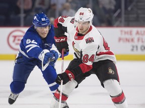 Ottawa Senators’ Aaron Luchuk (right) takes on Toronto Maple Leafs’ J.J. Piccinich yesterday in Laval, Que. (The Canadian Press)