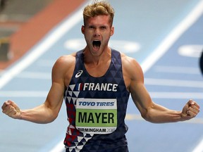 In this Saturday, March 3, 2018 file photo, France's Kevin Mayer celebrates to win the Heptathlon competition at the World Athletics Indoor Championships in Birmingham, Britain.