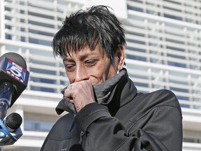 Evelyn Rodriguez, mother of Kayla Cuevas, 16, who was brutally slain in 2016 allegedly by members of the MS-13 street gang, weeps after stopping to talk members of the press gathered outside U.S. District Court in Central Islip, N.Y., Thursday, March 2, 2017. (AP Photo/Kathy Willens)