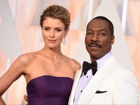 Paige Butcher, left, and Eddie Murphy arrive at the Oscars at the Dolby Theatre in Los Angeles, Feb. 22, 2015.