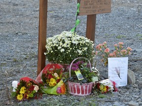 A memorial plaque was set up at the scene of the fatal OC Transpo bus and VIA Rail train crash in Ottawa on Sunday, Sept. 22, 2013.