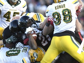 Redblacks running back William Powell carries the ball against the Edmonton Eskimos in Ottawa on Saturday. (Justin Tang/The Canadian Press)