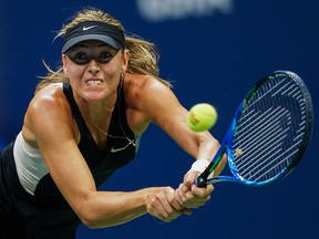 Maria Sharapova hits a return to Carla Suarez Navarro during their U.S. Open match at the USTA Billie Jean King National Tennis Center in New York on September 3, 2018. (EDUARDO MUNOZ ALVARE/AFP/Getty Images)