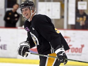 Pittsburgh Penguins' Sidney Crosby smiles as he skates during training camp, Friday, Sept. 14, 2018, in Cranberry Township, Pa. (THE CANADIAN PRESS/AP/Keith Srakocic)