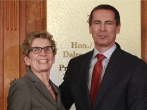 Kathleen Wynne and Dalton McGuinty in a 2013 file photo.
