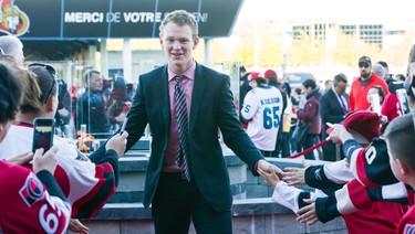 The Ottawa Senators' Brady Tkachuk walks the red carpet prior to the season opener.