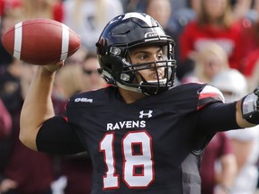 Quarterback Mike Arruda says the Ravens played a good first half against the Mustangs in the opener, but need to put together two good halves of football to have a shot of winning in the playoffs. Patrick Doyle/Postmedia