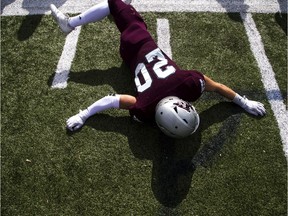 The Western Mustangs were in Ottawa to play the uOttawa Gee-Gees Saturday October 13, 2018 at the Gee-Gees Field. Gee-Gees #20 Luke Griese warms up before the game with some stretches.   Ashley Fraser/Postmedia