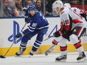 John Tavares of the Toronto Maple Leafs controls the puck against the Ottawa Senators during an NHL game at Scotiabank Arena on Saturday, Oct. 6, 2018.