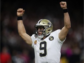 New Orleans QB Drew Brees celebrates during the first half of Monday's game against Washington.