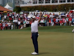 Marc Leishman of Australia celebrates on the 18th hole after clinching victory in the CIMB Classic at TPC Kuala Lumpur.