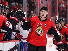 Mark Stone of the Senators celebrates the first of his two goals against the Canadiens on Saturday night.