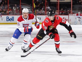 Maxime Lajoie #58 of the Ottawa Senators skates against Andrew Shaw #65 of the Montreal Canadiens in the first period at Canadian Tire Centre on October 20, 2018.