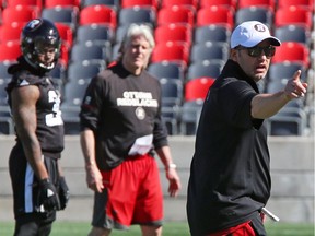 Defensive co-ordinator Noel Thorpe (white hat) says those involved with the Redblacks' defence are only worried about one thing: 'Our focus is on winning football games.'