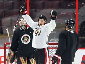 Mark Stone celebrates after scoring a goal against Craig Anderson, left, during Senators practice at Canadian Tire Centre on Tuesday. Jean Levac/Postmedia