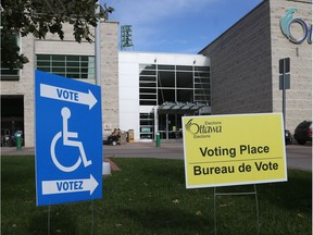 Signs direct voters to special advance polls at Ottawa City Hall earlier this month. Jean Levac/Postmedia