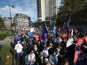 Anti-Brexit campaigners take part in the People's Vote March for the Future in London, a march and rally in support of a second EU referendum, in London, Saturday Oct. 20, 2018. Thousands of protesters gathered in central London on Saturday to call for a second referendum on Britain’s exit from the European Union.