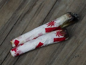 Marijuana joints rolled with Canadian-themed paper are photographed at a "Wake and Bake" legalized marijuana event in Toronto on Wednesday, October 17, 2018. Canada's decision to legalize cannabis will create a backlog in the courts as those charged with driving while drug-impaired are sure to launch a wave of legal challenges, a lawyer who specializes in impaired driving cases says.THE CANADIAN PRESS/Christopher Katsarov ORG XMIT: CPT121