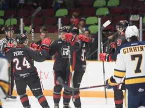 67's forward Graeme Clarke, third from left, celebrates with teammates Lucas Peric, Nikita Okhotyuk, second from left, and Quinn Yule, right, after scoring in the first period of Sunday's game against the Otters. Chris Hofley/OSEG