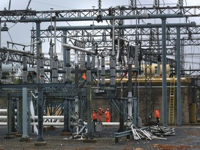 Hydro workers at the Merivale transmission station following a tornado that caused severe damage. September 25,2018.