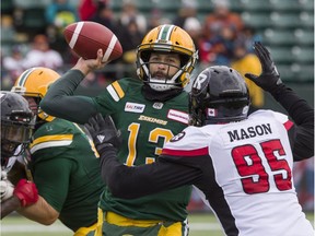 Redblacks defensive lineman Danny Mason (95) pressures Eskimos quarterback Mike Reilly during last Saturday's game in Edmonton.