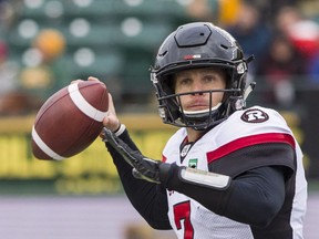 Redblacks quarterback Trevor Harris looks for a teammate on a pass play against the Edmonton Eskimos, in Edmonton on Saturday, Oct. 13, 2018.