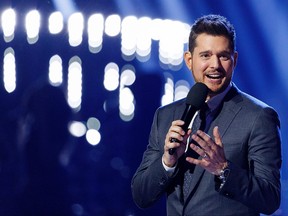 Singer Michael Buble speaks on stage during the 2018 JUNO Awards at Rogers Arena on March 25, 2018 in Vancouver. (Andrew Chin/Getty Images)