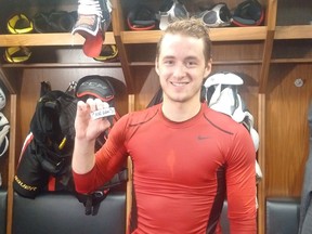 The Ottawa Senators' Max Lajoie shows off the puck after scoring his first career NHL goal in his debut game on Thursday, Oct. 4, 2018 at the Canadian Tire Centre. Bruce Garrioch, Postmedia