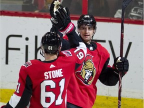 Senators centre Colin White celebrates with Mark Stone after scoring a goal against the Kings in the second period of Saturday's game.