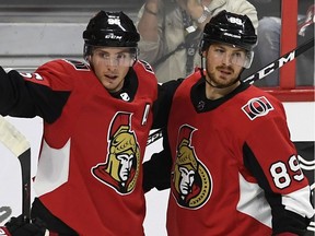 Mikkel Boedker, right, seen celebrating with Senators teammates Matt Duchene in the pre-season, is anxious to get out a prove he's worthy of the trade the team made to acquire him.