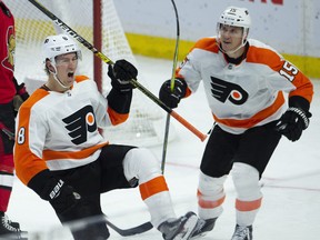 Philadelphia Flyers' Jori Lehtera races to congratulate teammate Robert Hagg as he celebrates his goal on Wednesday, Oct. 10, 2018 in Ottawa. (THE CANADIAN PRESS/PHOTO)