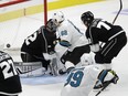 San Jose Sharks' Kevin Labanc (62) scores the game-winning goal past Los Angeles Kings goaltender Jonathan Quick, left, during overtime of an NHL hockey game Friday in Los Angeles. San Jose won 3-2.
