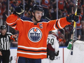 In this Feb. 22, 2018, file photo, Edmonton Oilers' Connor McDavid celebrates scoring in overtime against the Colorado Avalanche during an NHL hockey game, in Edmonton. (Jeff McIntosh/The Canadian Press via AP, File)