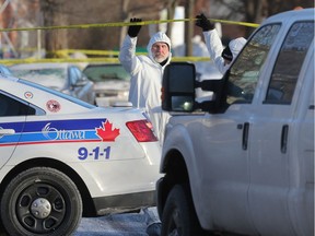 Police examine evidence at the scene on Claremont Drive after Mohamed Najdi was shot in January.