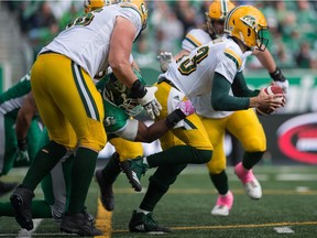 REGINA, SASK : October 8, 2018 -- Saskatchewan Roughriders defensive lineman Charleston Hughes (39) puts pressure on Edmonton Eskimos quarterback Mike Reilly during a game at Mosaic Stadium. BRANDON HARDER/ Regina Leader-Post