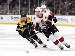 Boston's David Pastrnak, left, and Ottawa's Mark Stone.