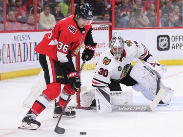 Colin White contols the puck before scoring on goalie Cam Ward in the first period.