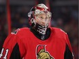 Goalie Craig Anderson looks on during a break in the second period of the season opener.