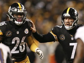 In this Dec. 10, 2017, file photo, Pittsburgh Steelers quarterback Ben Roethlisberger (7) directs running back Le'Veon Bell (26) during the second half of an NFL football game against the Baltimore Ravens in Pittsburgh.