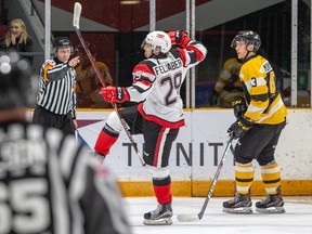 Tye Felhaber of the 67’s celebrates his eighth goal of the OHL season during last night’s game against the visiting Kingston Frontenacs. Jacob Murray of the Fronts looks on. The 67’s won the game 4-1.  VALERIE WUTTI/ photo